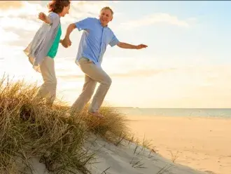 couple running on beach