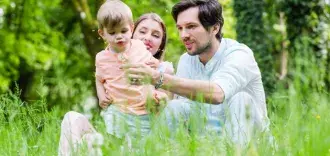 young family playing outside