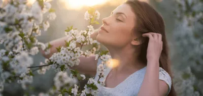 girl smelling flowers