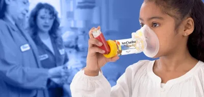 young girl using inhaler with spacer over top of medical professionals in blue background