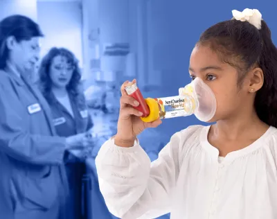 young girl with inhaler device