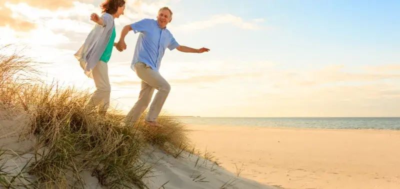 couple running on beach