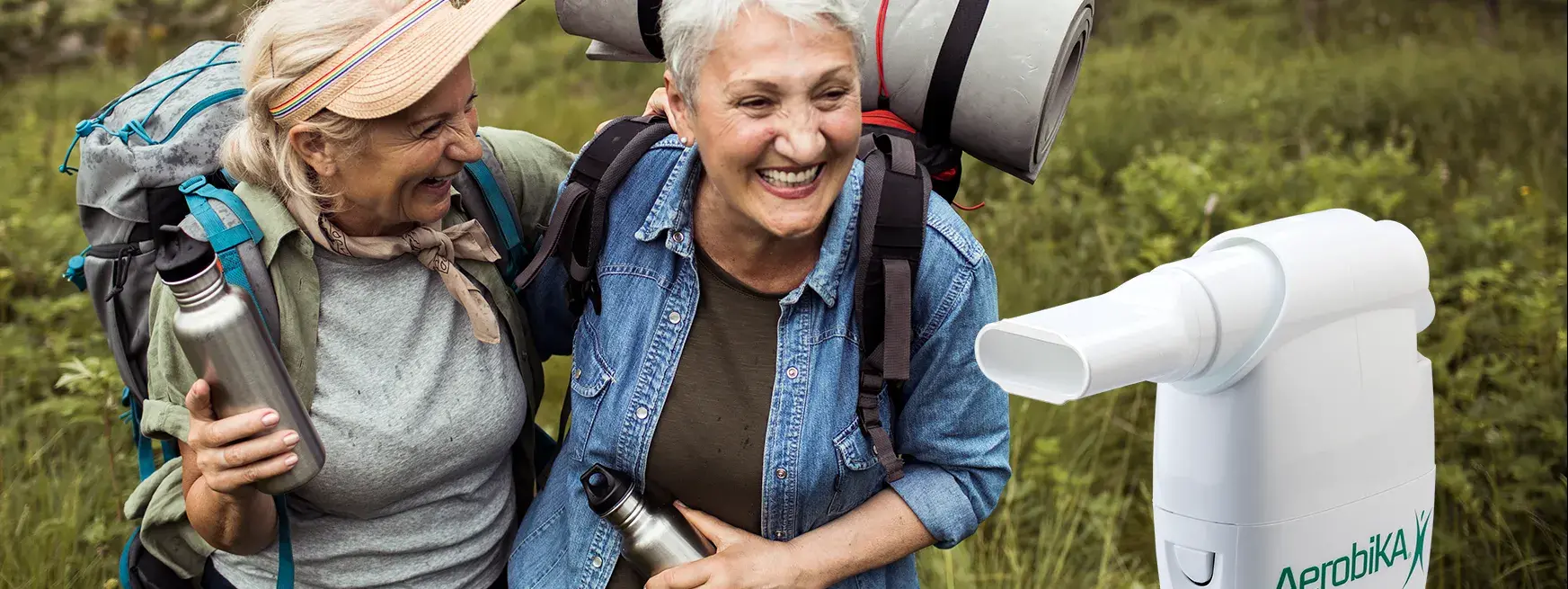 Two women hike with backpacks.